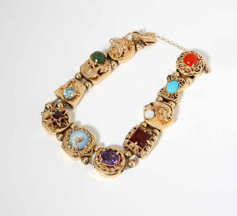 Appraisal: A slider bracelet with various gemstones and a painted portrait