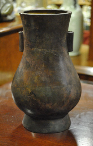 Appraisal: A Chinese bronze vase with tubular handles to the neck