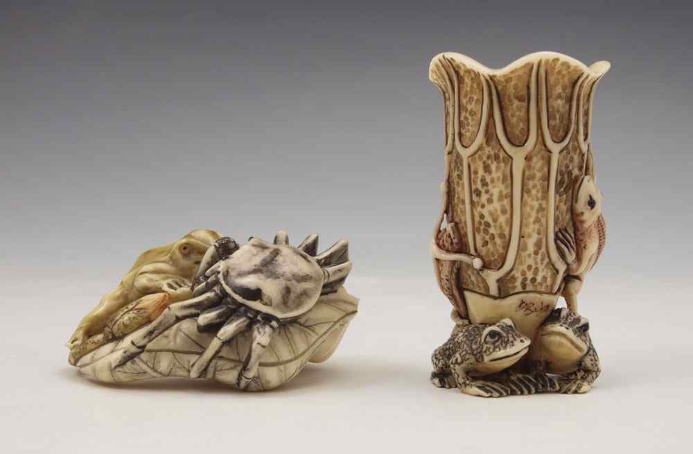 Appraisal: PIECE CARVED IVORY FLOWER FROG AND CRAB OKIMONO To include