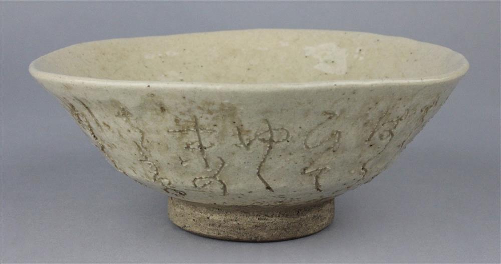 Appraisal: JAPANESE RENGETSU-STYLE INCISED POTTERY TEA BOWL of conical form with