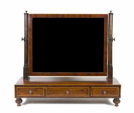 Appraisal: An English Mahogany Dressing Mirror having a rectangular plate raised