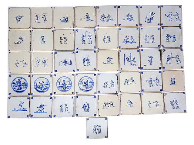 Appraisal: A COLLECTION OF FORTY ONE DELFT TILES depicting children playing