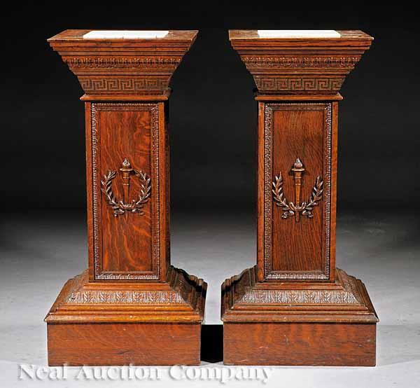 Appraisal: A Pair of American Carved Oak Pedestals in the Classical