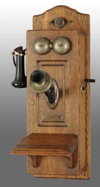 Appraisal: Vintage Oak Wall Telephone Description Made by Chicago Telephone Supply