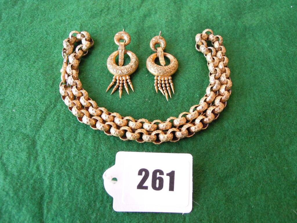 Appraisal: A Regency-style chain necklace each link with applied star motifs