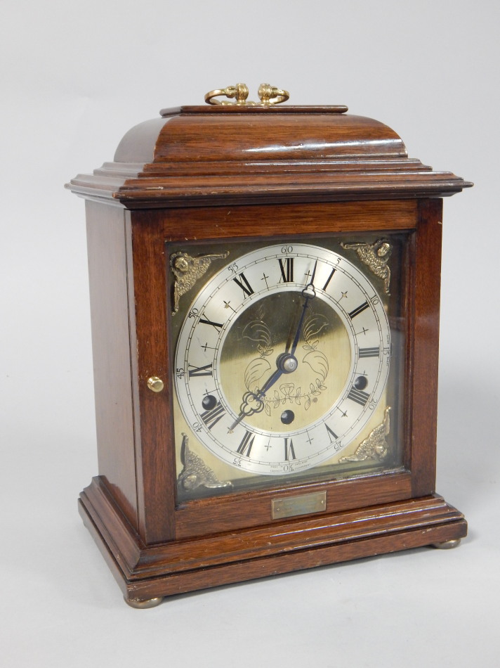 Appraisal: A reproduction George III mahogany bracket clock with a brass