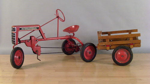 Appraisal: International tractor pedal car with cart together with a green