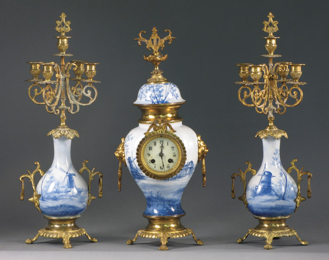 Appraisal: THREE-PIECE ORMOLU AND BLUE DELFT-LIKE PORCELAIN CLOCK SET French c