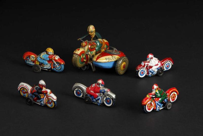 Appraisal: Lot of Tin Motorcycle Friction Wind-Up Toys Description Japanese All