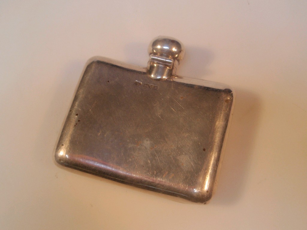 Appraisal: An Edwardian silver hip flask Chester