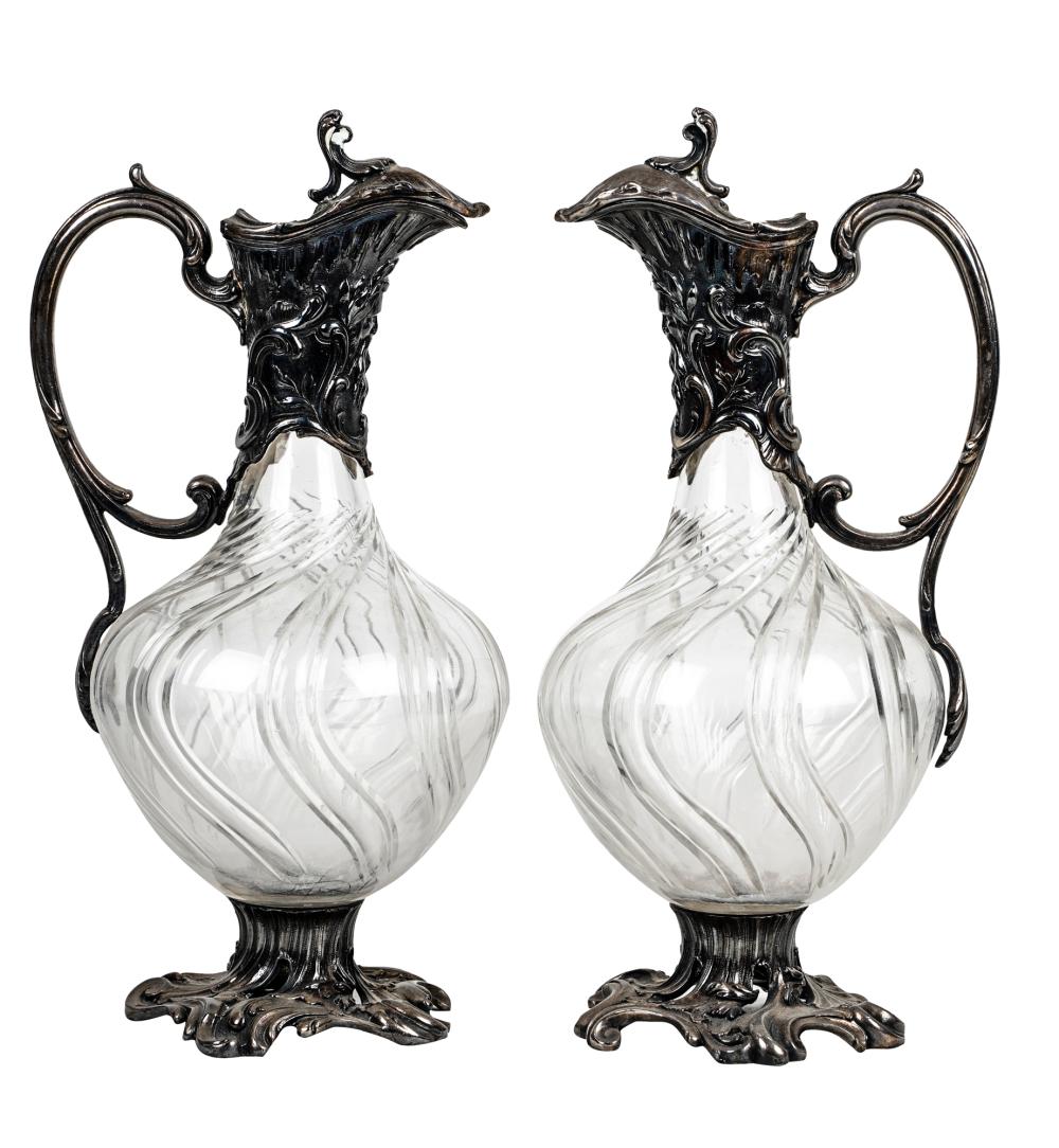 Appraisal: TWO SILVERPLATE AND GLASS EWERS inches high Condition