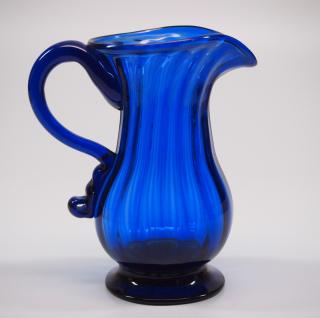 Appraisal: Pattern A late th century Stiegel type pattern-molded glass creamer