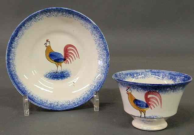 Appraisal: Rare rooster blue spatterware handleless cup and saucer early th