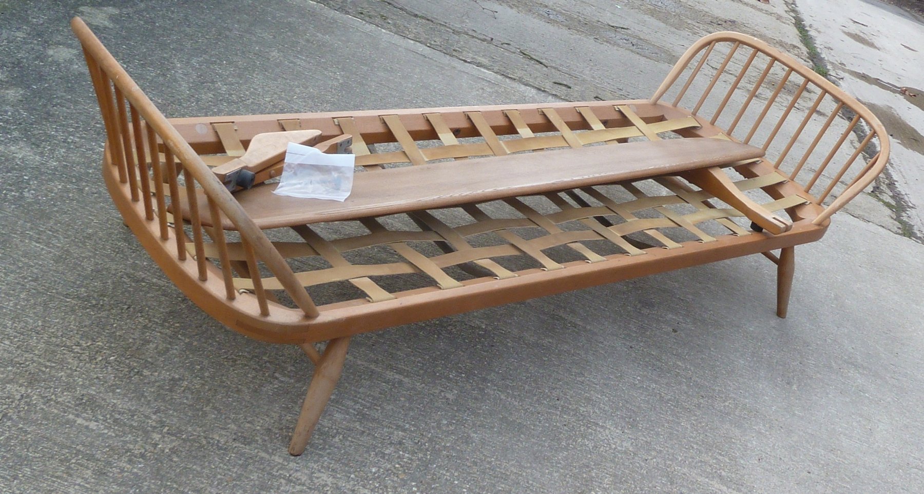 Appraisal: A twin stick back Ercol settee with webbing and back