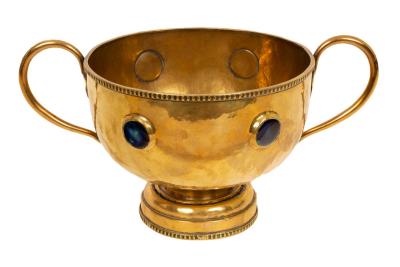 Appraisal: An Arts Crafts brass twin handled pedestal bowl with Ruskin