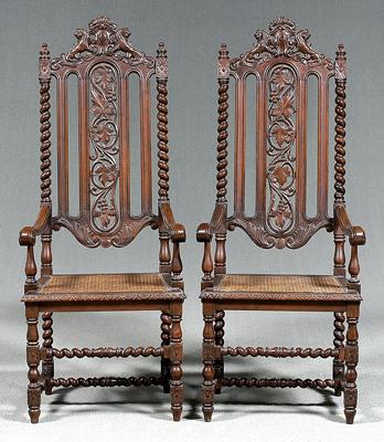 Appraisal: Pair Jacobean style armchairs carved walnut with lion crest pierced