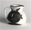 Appraisal: PABLO PICASSO Heads Partially glazed terre de fa ence pitcher