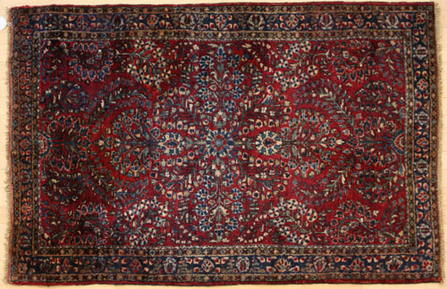 Appraisal: Sarouk carpet ca with overall floral pattern on a red