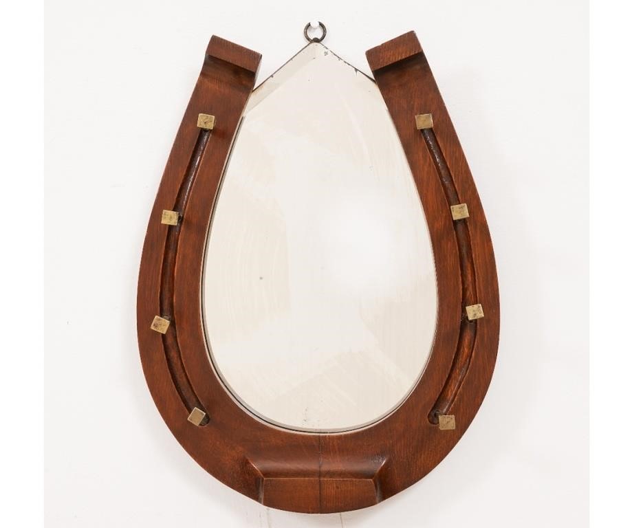 Appraisal: Mahogany horseshoe form mirror with brass spike bridle holders h