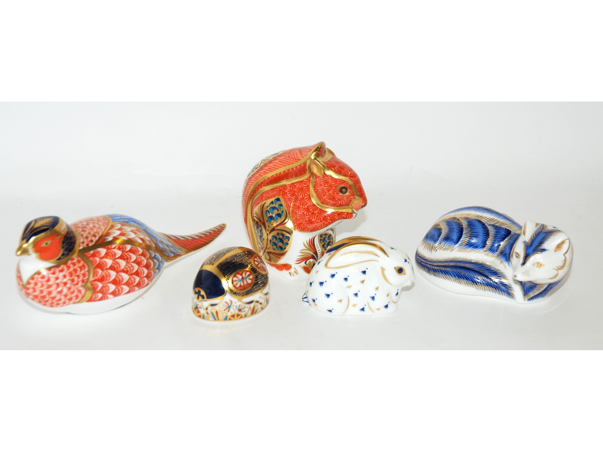 Appraisal: Five Royal Crown Derby paperweights including Pheasant Squirrel Ladybird Rabbit