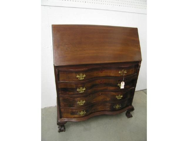 Appraisal: Mahogany Dropfront Desk serpentine front interior compartments four drawer ball