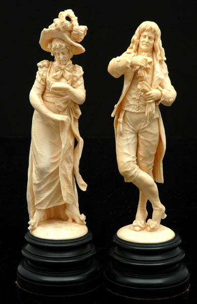 Appraisal: A PAIR OF CONTINENTAL CARVED IVORY FIGURES OF A LADY