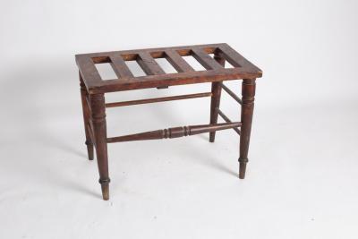 Appraisal: An Edwardian walnut luggage stand on turned legs cm x