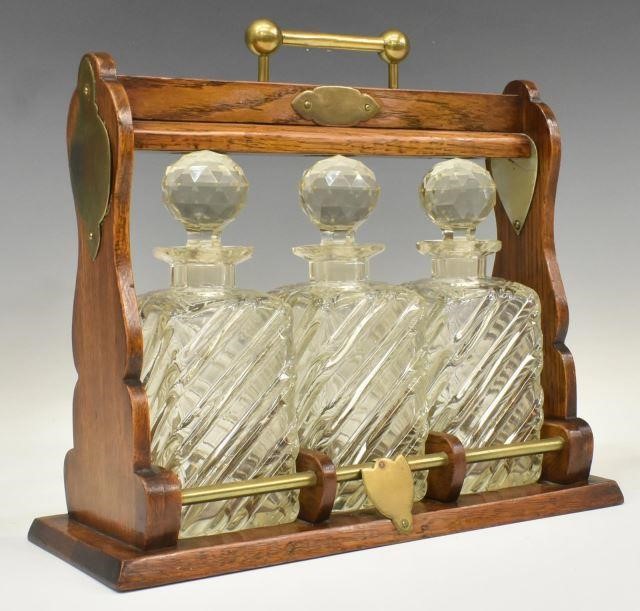 Appraisal: English Tantalus liqueur set late th c having a locking