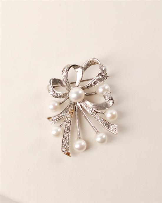 Appraisal: A Gold Pearl and Diamond Bow Brooch K marked white