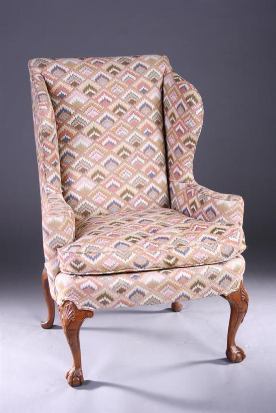 Appraisal: GEORGIAN STYLE CARVED WALNUT EASY CHAIR th century with bargello