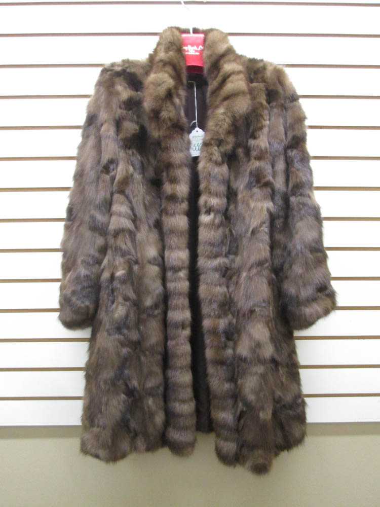 Appraisal: LADY'S MINK COAT with three button closures and two exterior