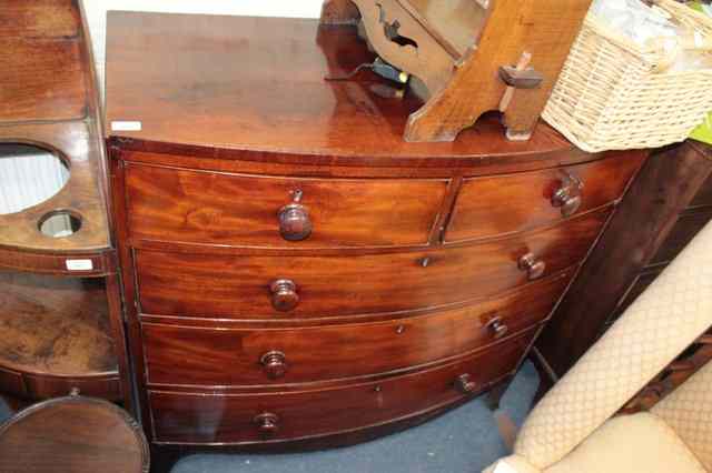 Appraisal: A TH CENTURY MAHOGANY BOW FRONTED CHEST of two short