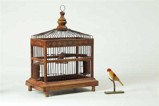 Appraisal: BIRDCAGE WITH CARVED BIRD American th century Wood and wire