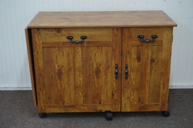 Appraisal: Modern era knotty pine finished look sewing table with drop