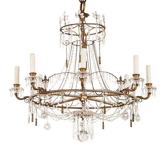 Appraisal: A Regency Style Gilt Metal and Crystal Eight-Light Chandelier Height