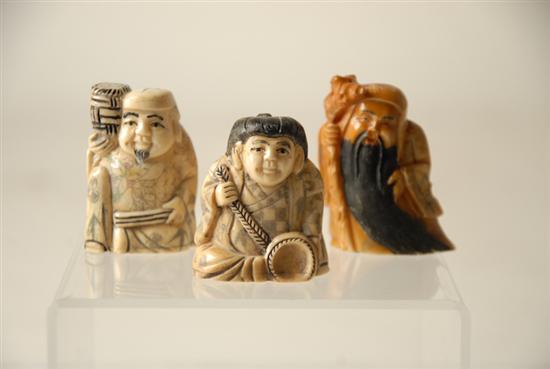 Appraisal: Three Hippo Ivory Netsuke of three gentlemen holding different objects