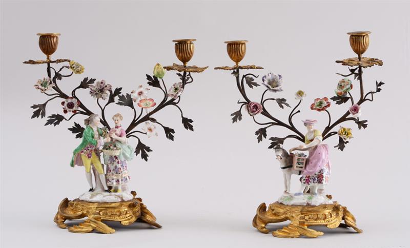 Appraisal: PAIR OF LOUIS XV STYLE ORMOLU-MOUNTED PORCELAIN FIGURAL TWO-LIGHT CANDELABRA