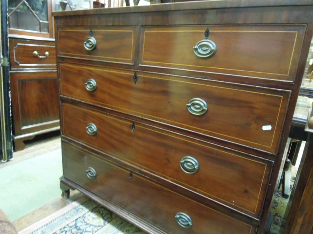 Appraisal: A Georgian mahogany chest fitted with three long and two