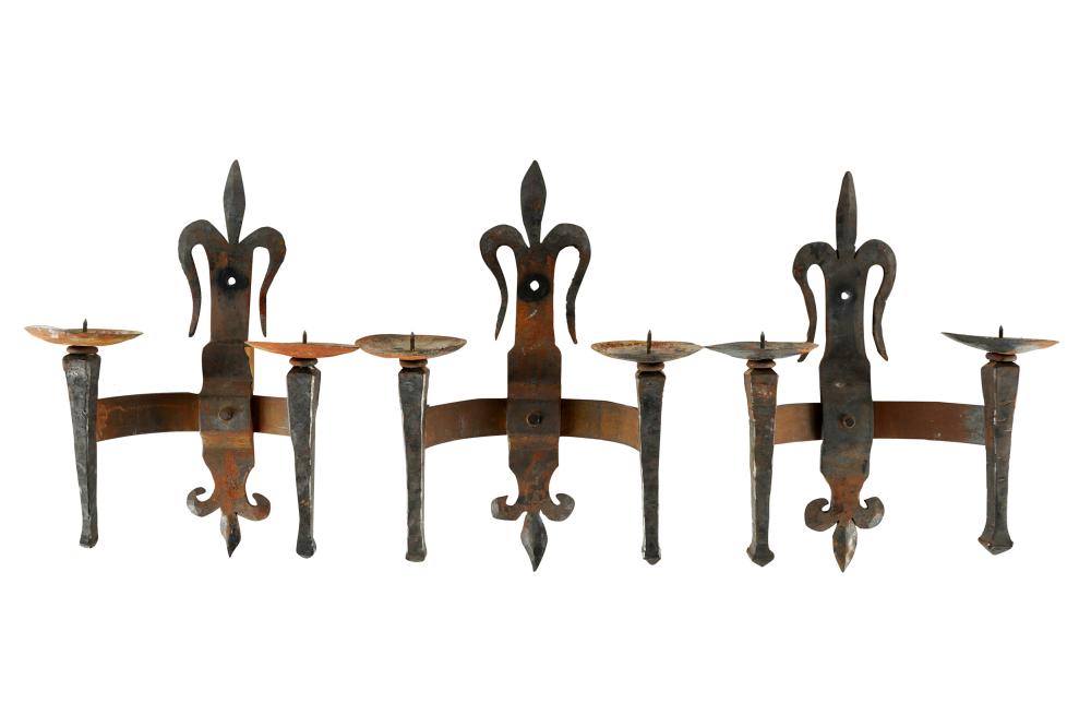 Appraisal: THREE SPANISH-STYLE WROUGHT IRON CANDLE SCONCESeach with two prickets Condition