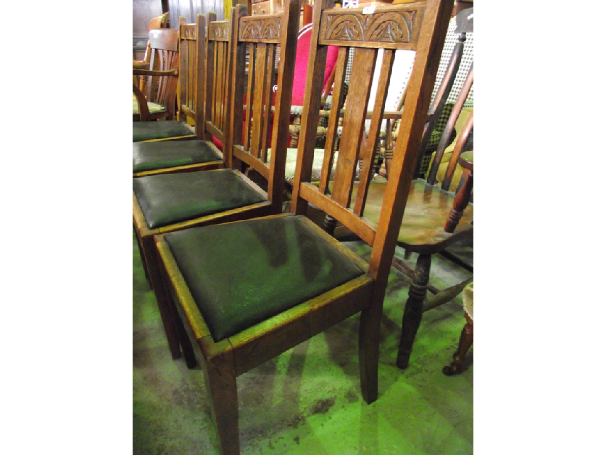 Appraisal: A set of four oak framed stickback dining chairs with