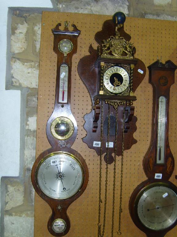 Appraisal: A th century rosewood veneered wheel barometer with silvered dials