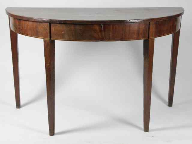 Appraisal: A George III mahogany D-end table on square tapering legs