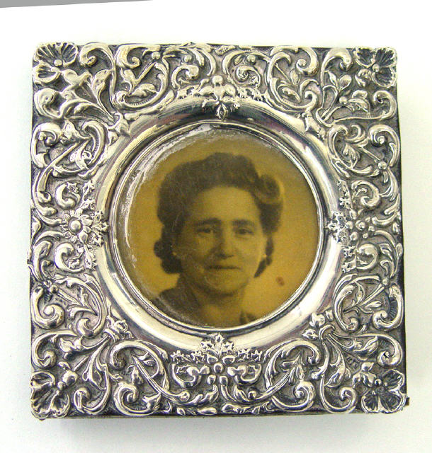 Appraisal: Square silver photo frame embossed with swags and flowers Birmingham