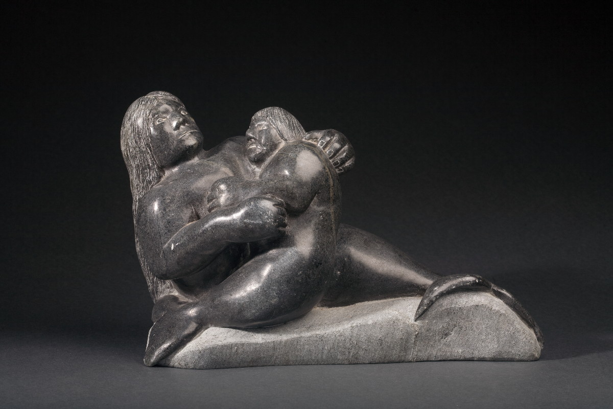 Appraisal: INUIT SOAPSTONE CARVING OF TWO MERMAIDS Depicting a quot mother