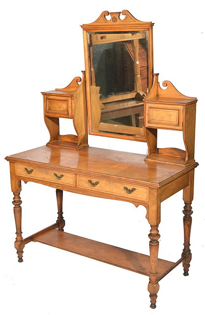 Appraisal: A VICTORIAN OAK AND ASH DRESSING TABLE with carved scroll