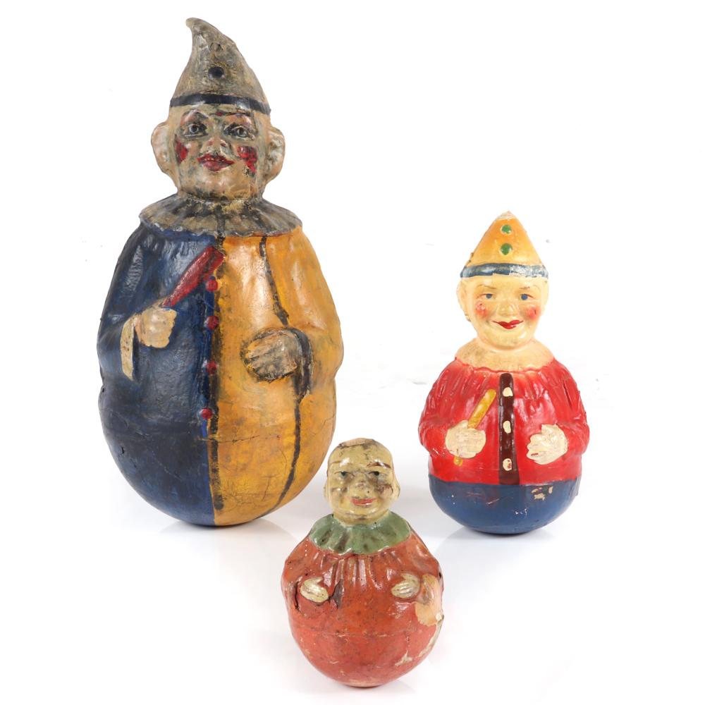 Appraisal: THREE HAND-PAINTED PAPER MACHE ROLY POLY CLOWN TOYS H TALLEST