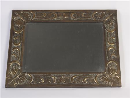 Appraisal: An Arts and Crafts style brass framed wall mirror the