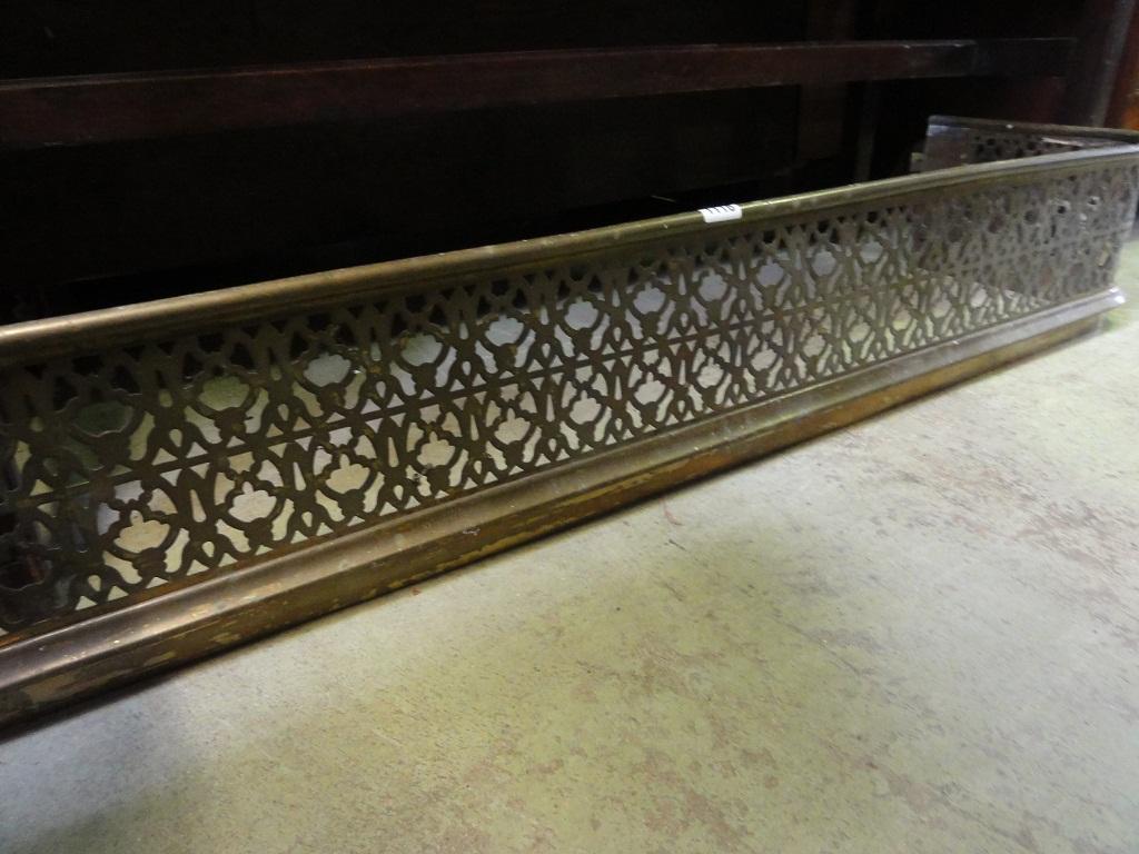 Appraisal: A Victorian pierced brass fender with gothic tracery detail