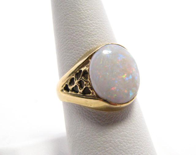 Appraisal: k yellow gold oval opal ring in filigree and solid