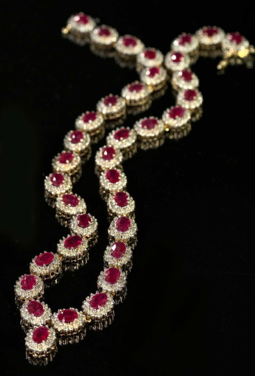 Appraisal: Fourteen-Karat Yellow Gold Ruby and Diamond Necklace featuring a flexible